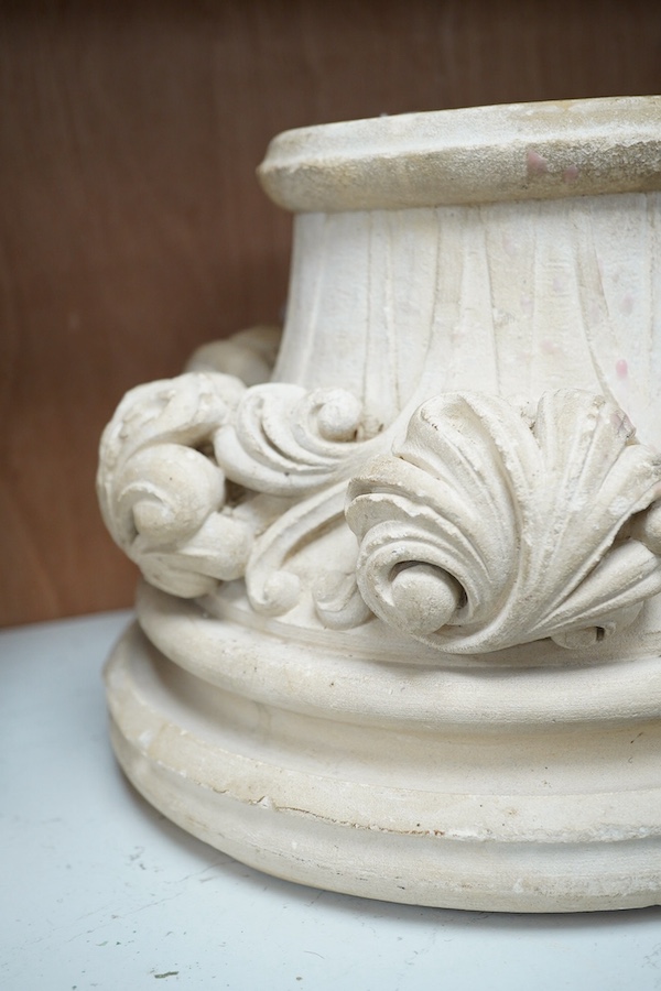 A reconstituted stone circular column base, 29cm diameter. Condition - fair